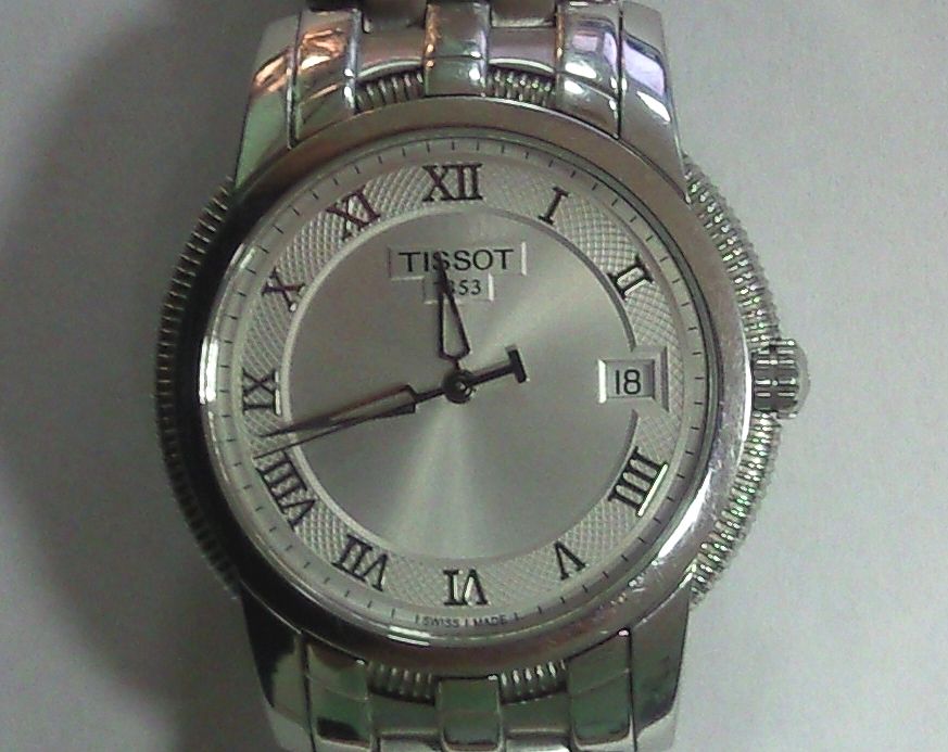 Часы марки Tissot с традиционным написанием «IIII»